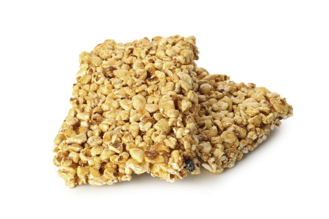 Tasty peanut brittles isolated on light background