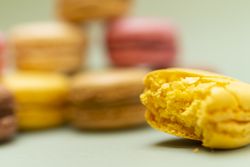 Colored tasty lemon macaroon on a green table