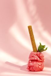 Strawberry ice cream scoops with waffle stick