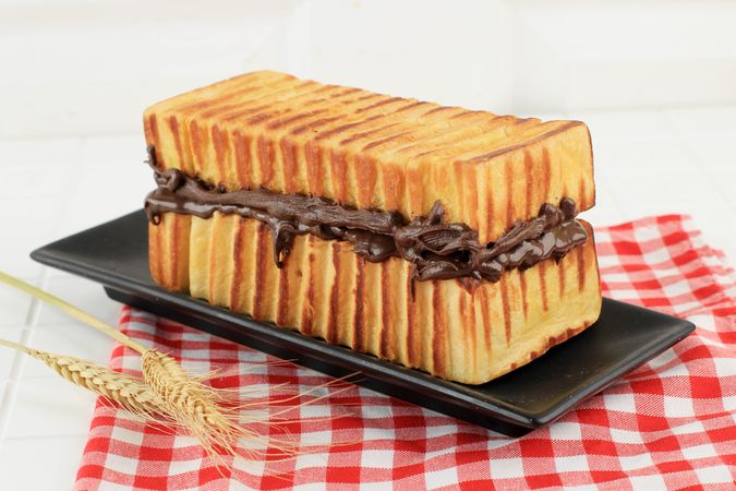 Side view of loaf of toasted bread with chocolate filling