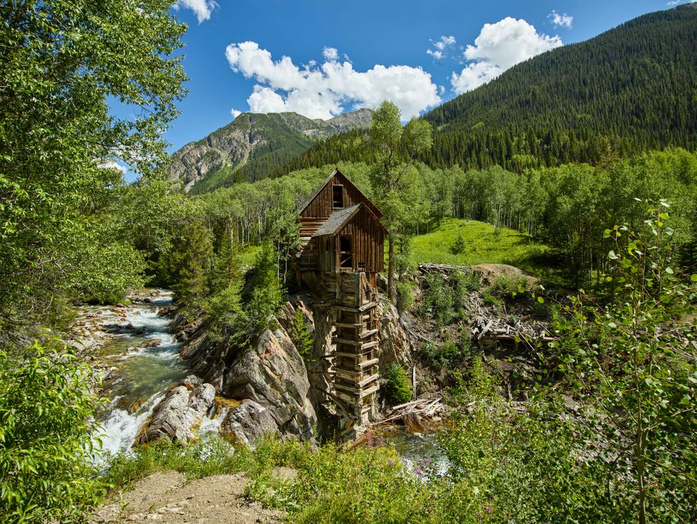 Rustic log powerhouse above Crystal River in Colorado