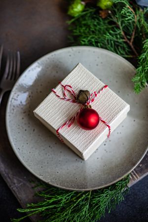 Close up of Christmas holiday gift in center of table