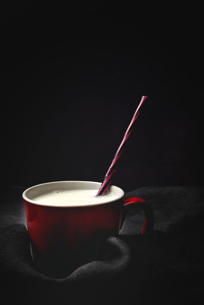 Cup of milk on table