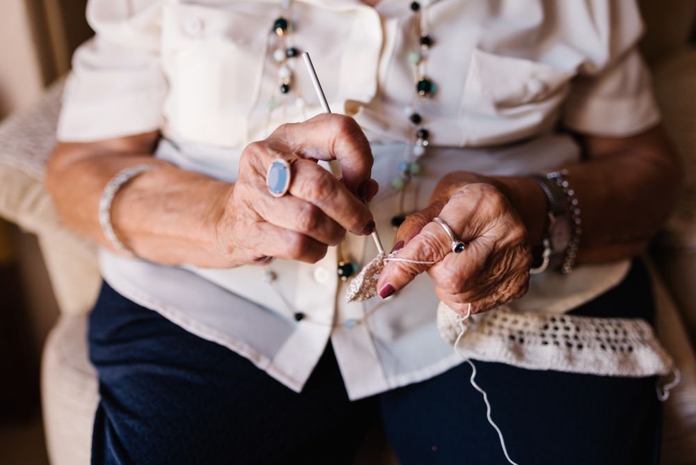 Older woman knitting crochet