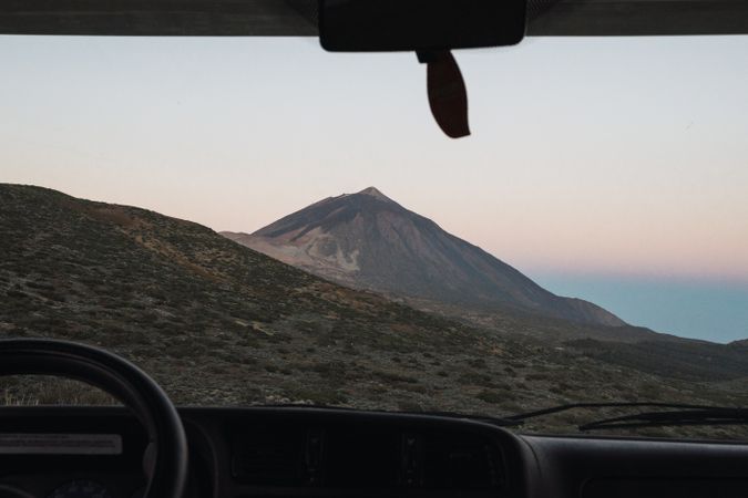 View of mountain through window of car
