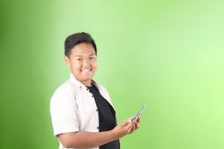 Asian Kids Boy in Casual Outfit using Mobile Phone