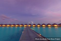 Overwater bungalows lit up at night 48X2k4