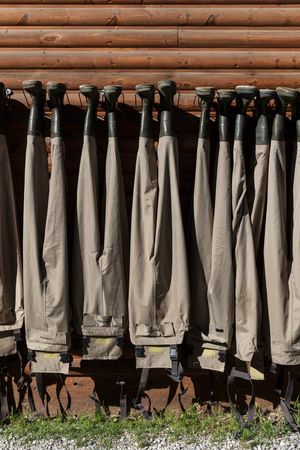 Chest-high boots called waders hanging on wall, near Riverside, Wyoming