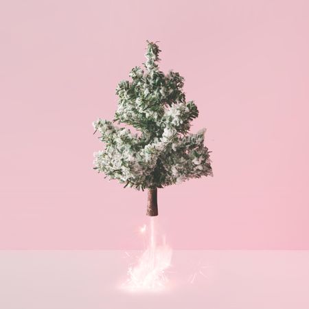 Christmas tree blasting off with fireworks emerging from base