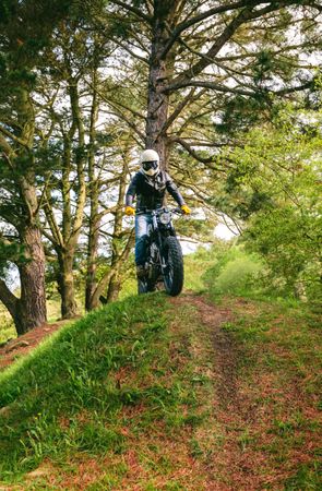 Man with helmet riding custom motorbike
