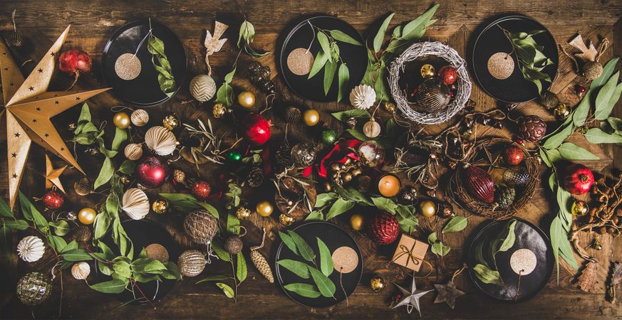 Holiday decorations of stars, baubles, leaves, and ribbon