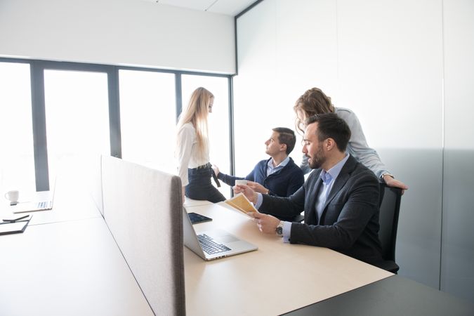 coworkers in teams inside of office