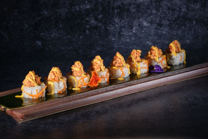 Delicious sushi served on tray in restaurant