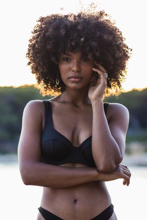 Calm Black woman in bikini in sea