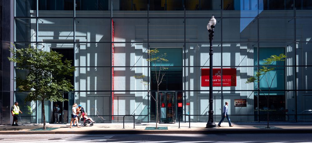A crosshatch shadow pattern dominates this street scene in downtown Chicago, Illinois