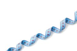 Measuring tape isolated on light background. Weight loss