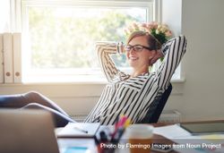 Happy female entrepreneur leaning back and relaxing while working from home office 41xKg5