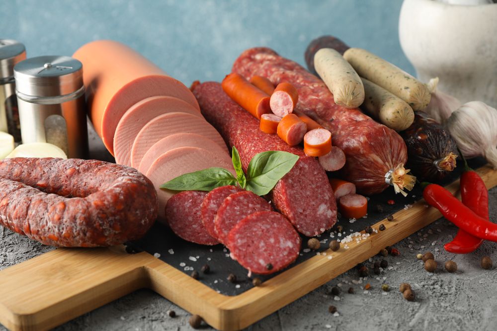 Board of cured meat variety in blue kitchen