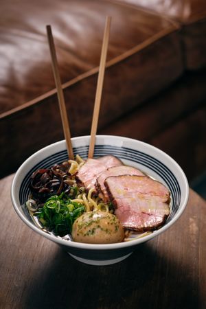 Bowl of delicious ramen soup served in restaurant