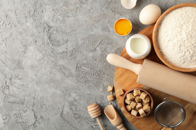 Composition with different kitchen cutlery on gray background, top view