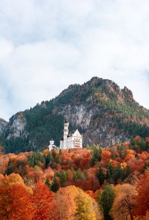 Autumn scenery in Bavaria with Neuschwanstein castle on top of the mountain