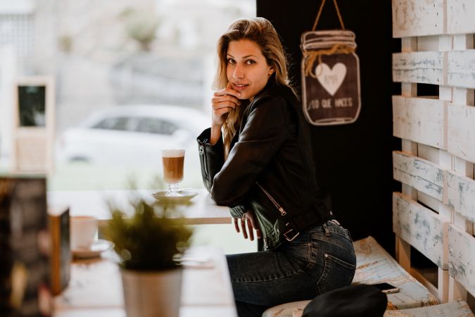 Woman drinking coffee from a glass