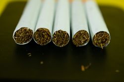 Top of five cigarettes with copy space