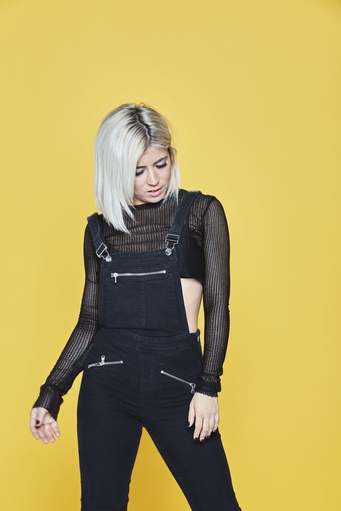female in faux leather outfit