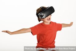 Smiling girl excited by VR glasses and gesturing with arms outstretched 41GYl0