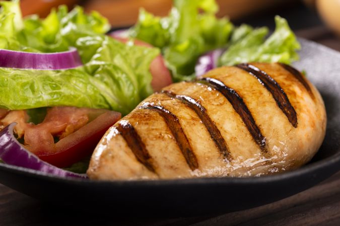 Tasty grilled chicken with salad.