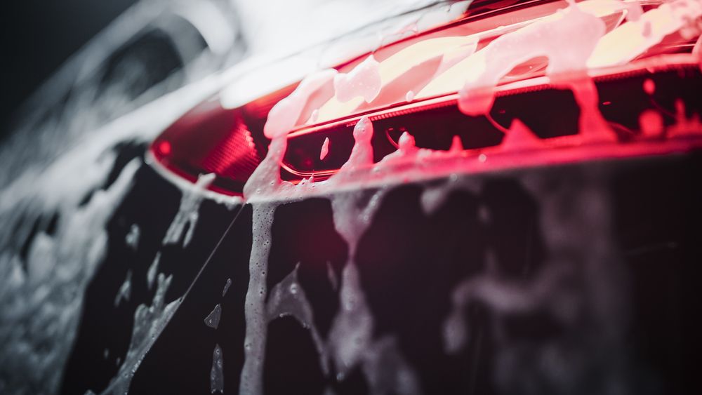 Brake Light on a Modern Car. Close Up Aesthetic Photo of a Vehicle in a Car Wash.