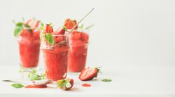 Blended strawberry granita with mint garnish