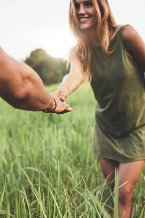 Loving young couple on meadow outdoors