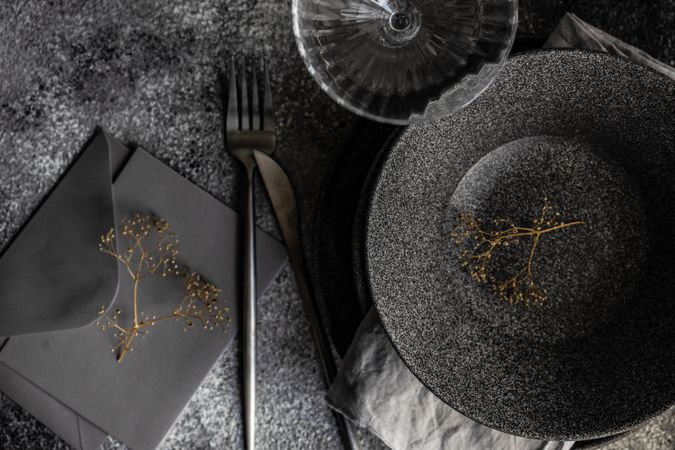 Table setting with delicate dried flower and envelope