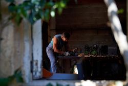 Man working with saw in workshop
