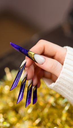 Glittering Purple Stiletto Nails