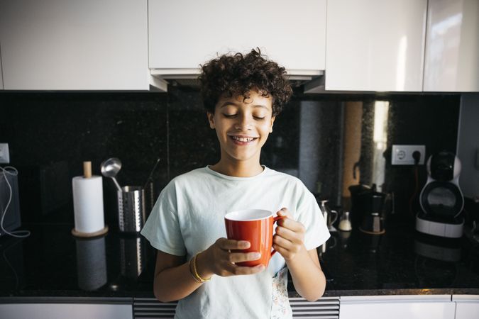 Girl drinking a cup of milk