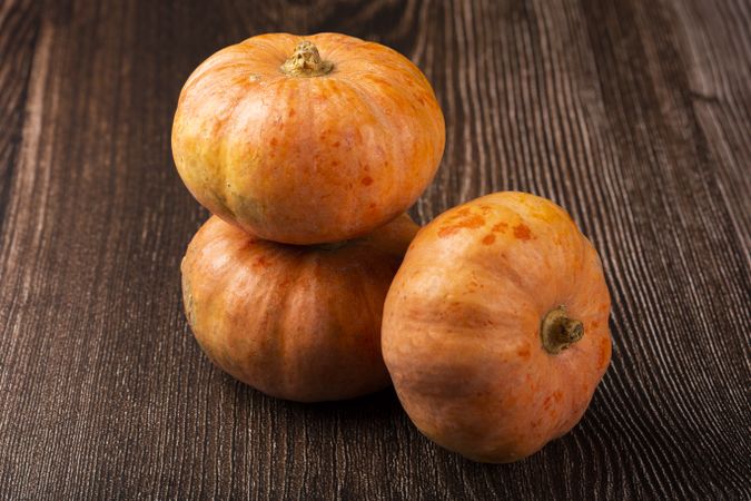 Pumpkins on the wooden table.
