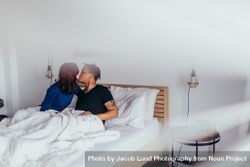 Romantic couple kissing in bed 5Q7Wmb