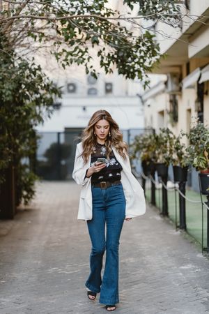 Woman talking phone on street