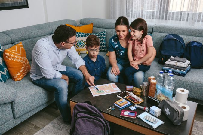 Father explaining to his family the emergency assembly point