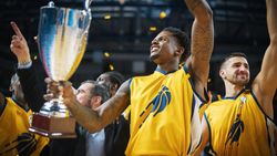 Yellow Team Basketballers Celebrating Successful Victory Over a National Basketball Club