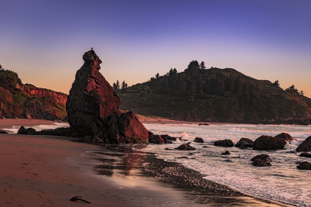 Calm waves coming onto rocky beach