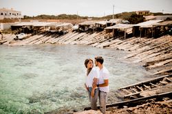 Happy lovers cuddling at cove