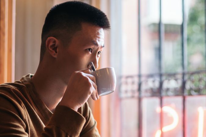 Asian man on a date in a coffee shop