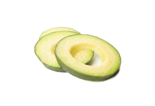 Ripe fresh avocado slices isolated on plain background