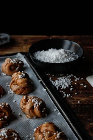 Sugar and cutter near cardamom buns