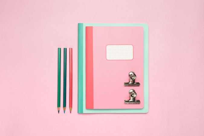 School stationery set on pink background