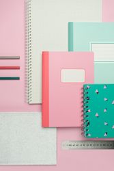 School stationery set on pink background