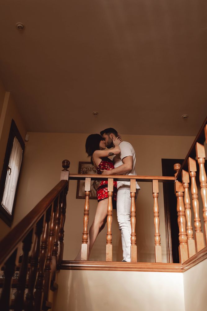 Couple kissing on stairway
